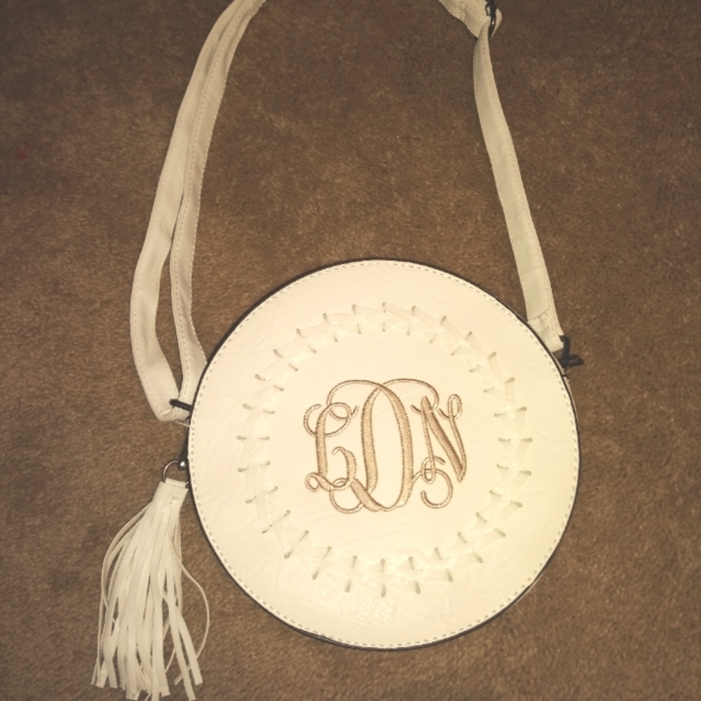 Off white monogrammed purse. Initials are LND